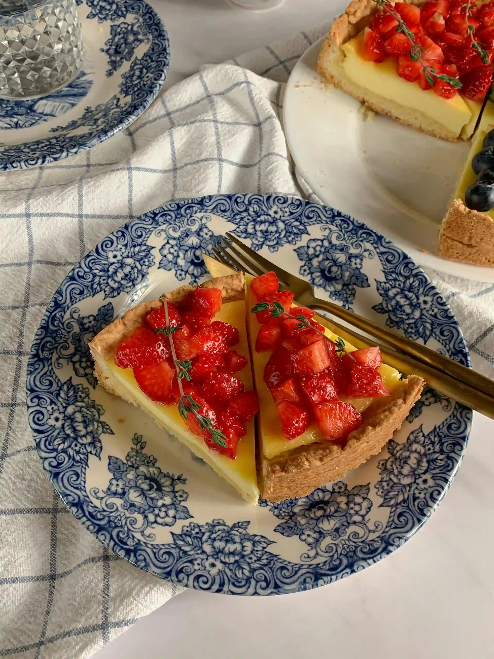 Assorted desserts including chocolate cake, fruit tart, and creamy pudding arranged on a rustic wooden table.